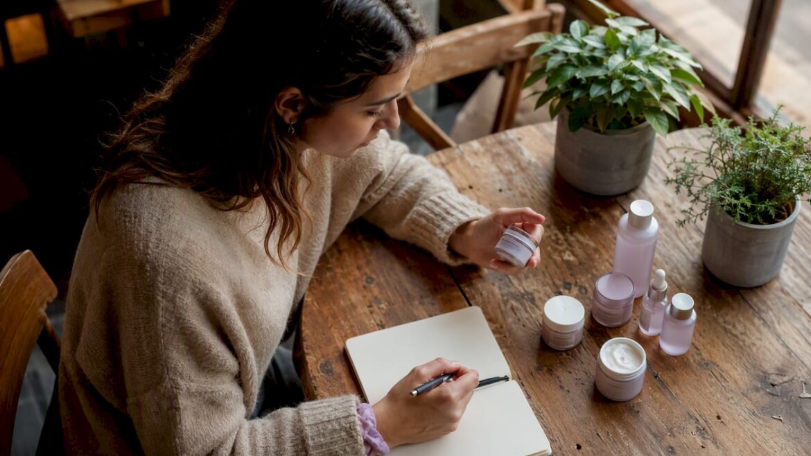 Woman reviewing natural skincare products indoors