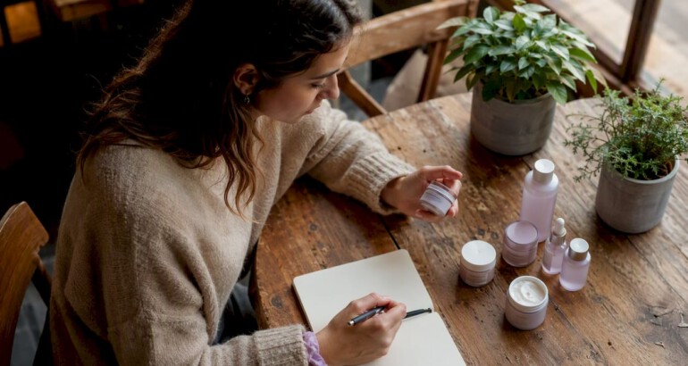 Woman reviewing natural skincare products indoors