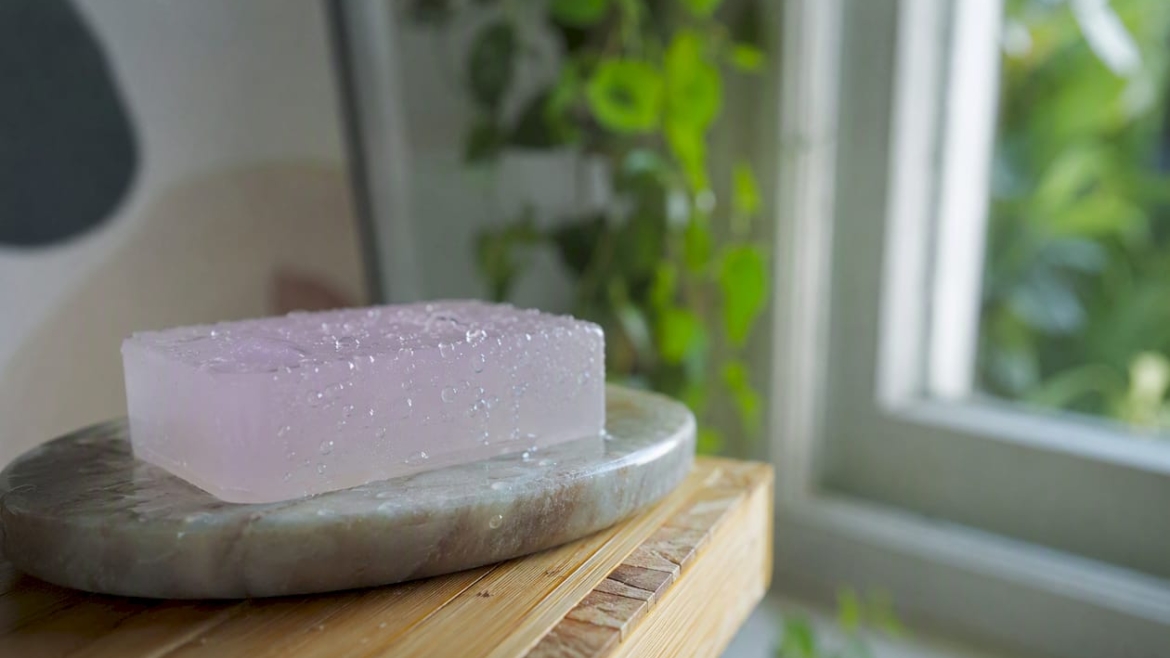 Glycerin soap bar on wooden soap dish