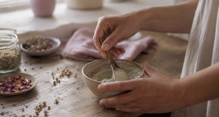 Hands mixing botanical facial mask