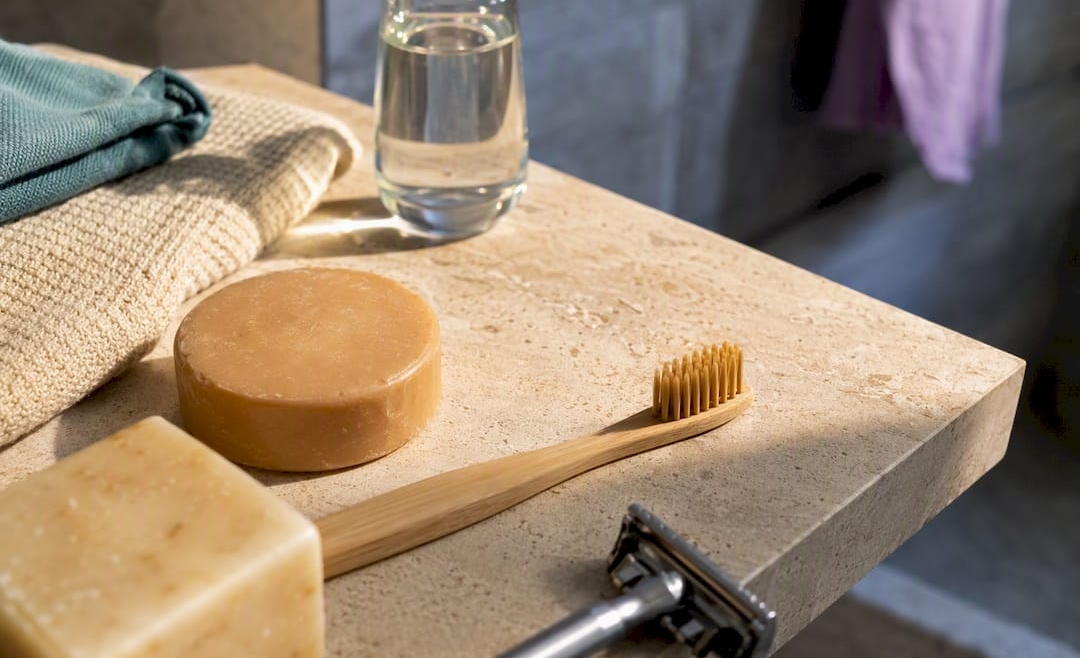 Plastic-free bathroom materials on limestone shelf