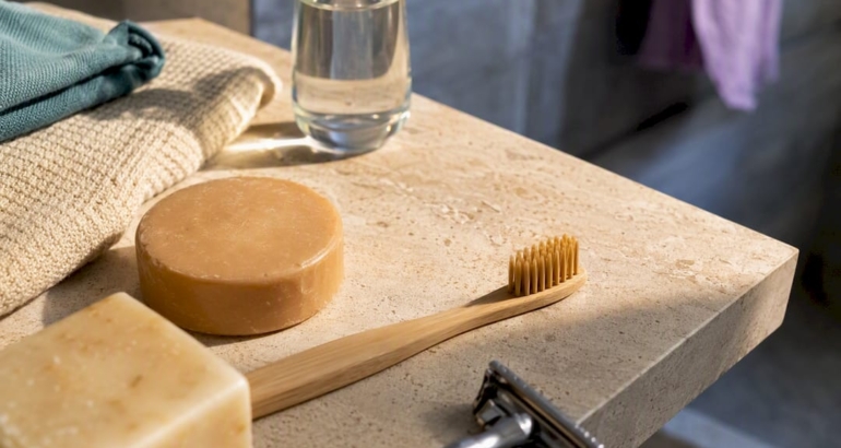 Plastic-free bathroom materials on limestone shelf