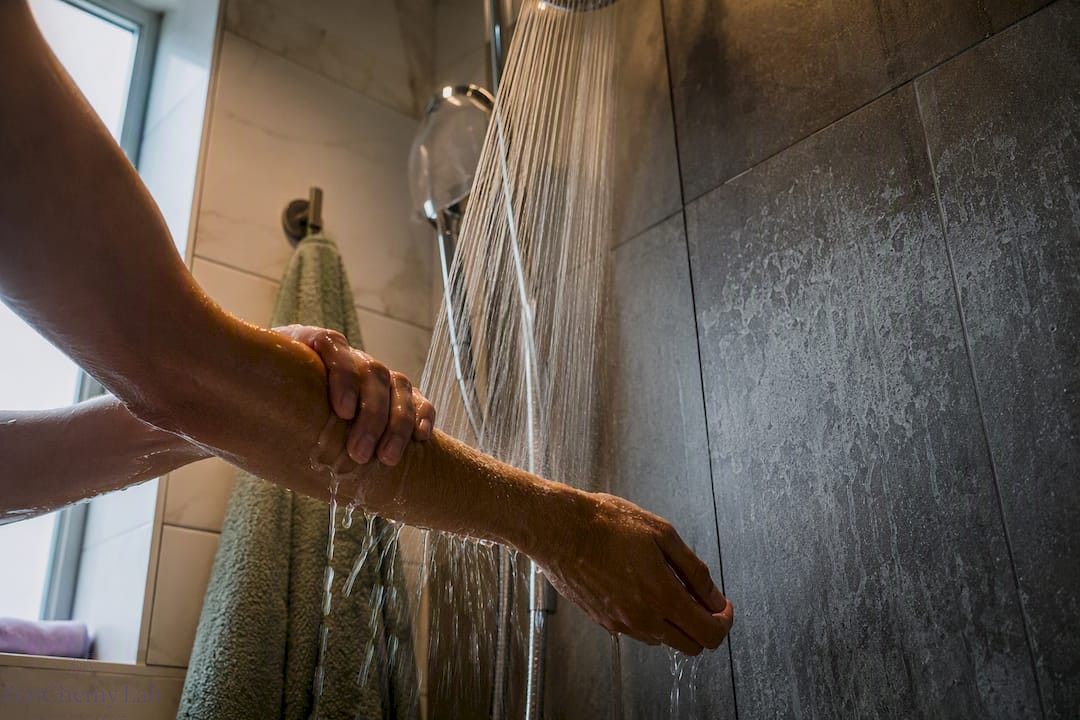 Hands rinsing hard-water residue from skin